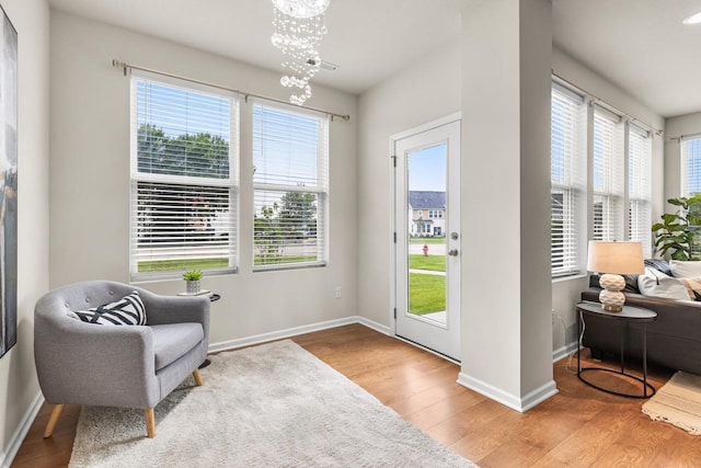 732 Wildflower Ln, Chanhassen, MN 55317 - living area featuring a chandelier and wood finished floors