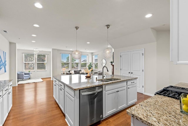 732 Wildflower Ln, Chanhassen, MN 55317 - kitchen with stainless steel dishwasher, light wood-style flooring, open floor plan, a chandelier, and recessed lighting