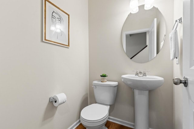 732 Wildflower Ln, Chanhassen, MN 55317 - half bathroom with toilet and wood finished floors