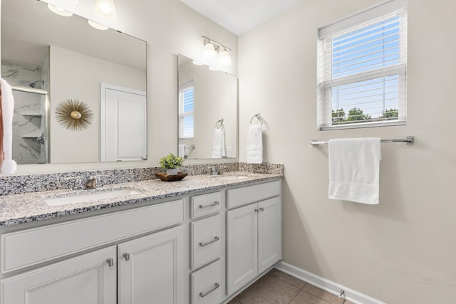 732 Wildflower Ln, Chanhassen, MN 55317 - full bathroom with double vanity, tile patterned floors, and an enclosed shower