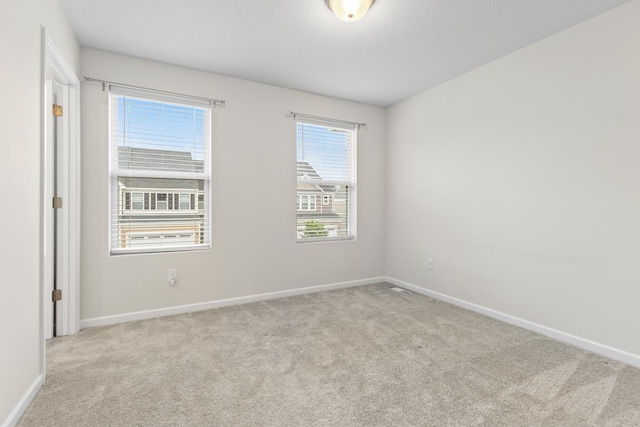 732 Wildflower Ln, Chanhassen, MN 55317 - spare room featuring carpet floors and baseboards