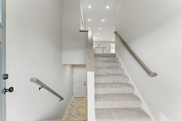 2720 Kepler Ave NE, Saint Michael, MN 55376 - staircase featuring marble look tile flooring and recessed lighting