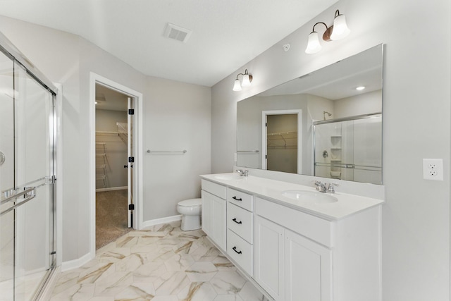 2720 Kepler Ave NE, Saint Michael, MN 55376 - full bath featuring a walk in closet, a shower stall, double vanity, and marble finish flooring