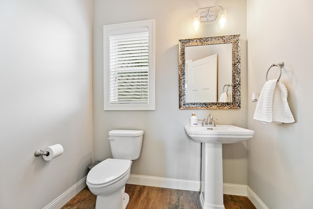 19550 Albany Cir NW, Elk River, MN 55330 - bathroom with baseboards and wood finished floors