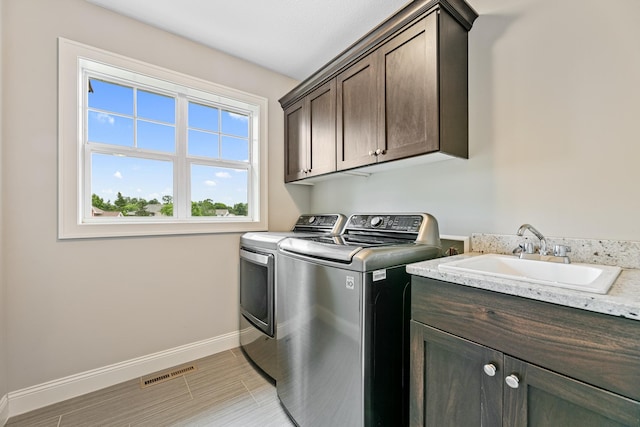 19550 Albany Cir NW, Elk River, MN 55330 - washroom featuring washing machine and dryer and cabinet space