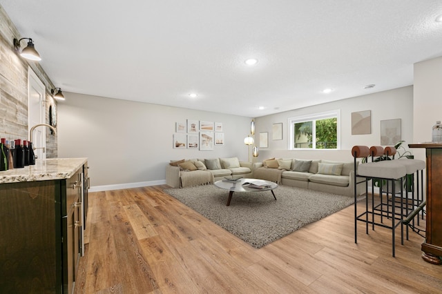 19550 Albany Cir NW, Elk River, MN 55330 - living area featuring light wood-type flooring and recessed lighting