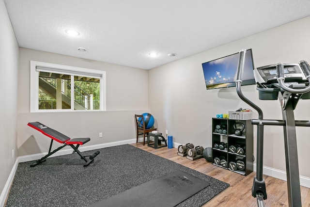 19550 Albany Cir NW, Elk River, MN 55330 - exercise room with wood finished floors and recessed lighting