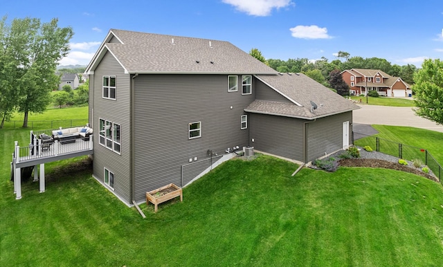 19550 Albany Cir NW, Elk River, MN 55330 - rear view of house featuring roof with shingles, outdoor lounge area, and a deck