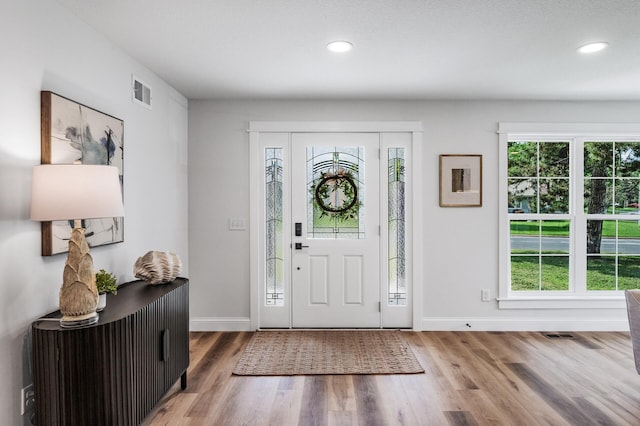 6901 Dawson Ln, Edina, MN 55435 - entrance foyer with plenty of natural light, wood finished floors, and recessed lighting