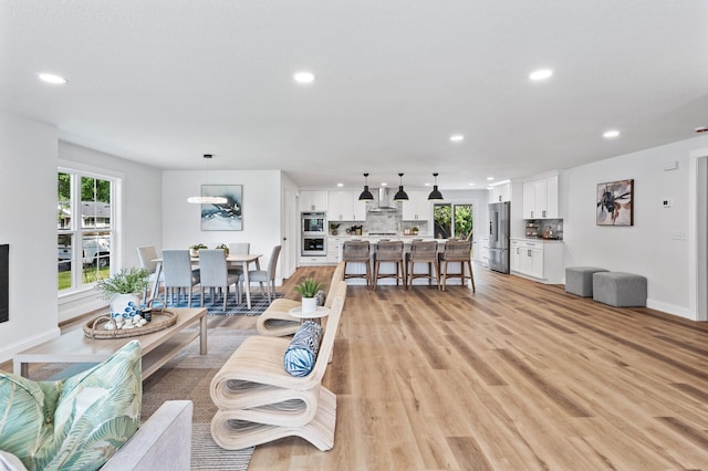 6901 Dawson Ln, Edina, MN 55435 - living area with recessed lighting, plenty of natural light, and light wood-style flooring