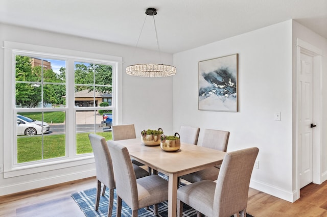 6901 Dawson Ln, Edina, MN 55435 - dining room featuring light wood-style flooring and baseboards