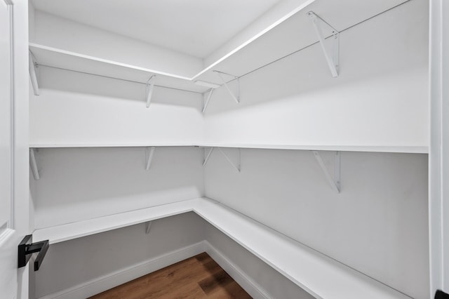 6901 Dawson Ln, Edina, MN 55435 - walk in closet featuring dark wood-style floors