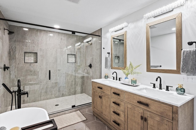 6901 Dawson Ln, Edina, MN 55435 - bathroom featuring a stall shower, double vanity, recessed lighting, a soaking tub, and tile patterned floors