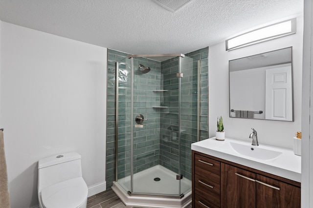 6901 Dawson Ln, Edina, MN 55435 - bathroom with a stall shower, vanity, a textured ceiling, and wood finished floors
