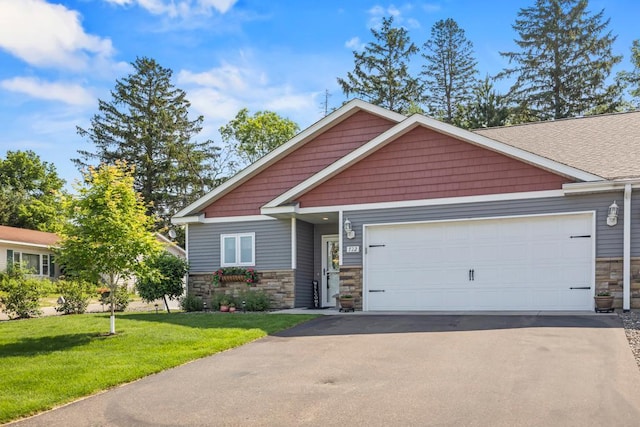 722 Hilltop Dr, Taylors Falls, MN 55084 - craftsman-style home featuring stone siding, a garage, asphalt driveway, and a front yard