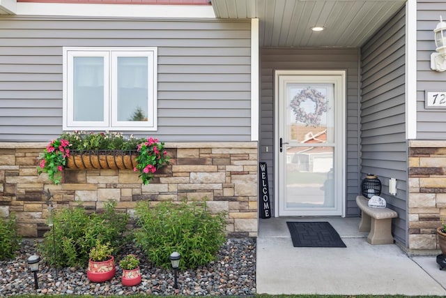 722 Hilltop Dr, Taylors Falls, MN 55084 - doorway to property featuring stone siding