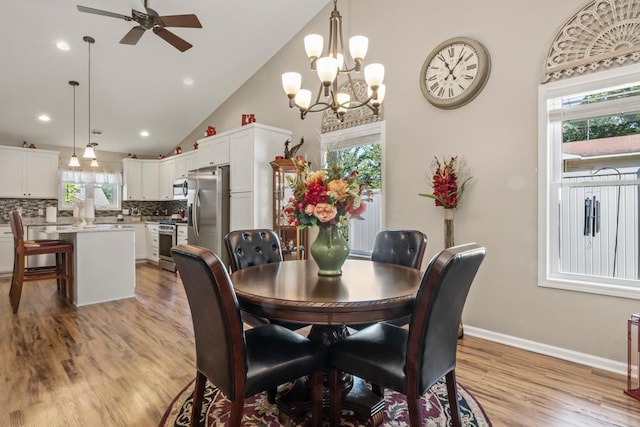 722 Hilltop Dr, Taylors Falls, MN 55084 - dining room with a chandelier, lofted ceiling, a ceiling fan, light wood-type flooring, and recessed lighting
