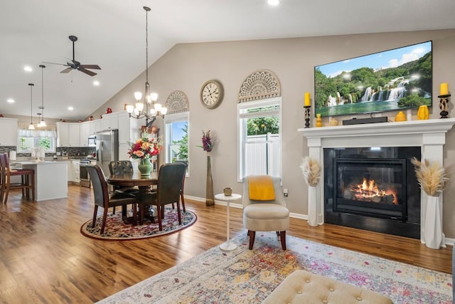 722 Hilltop Dr, Taylors Falls, MN 55084 - dining space with a ceiling fan, a chandelier, a glass covered fireplace, light wood-type flooring, and recessed lighting