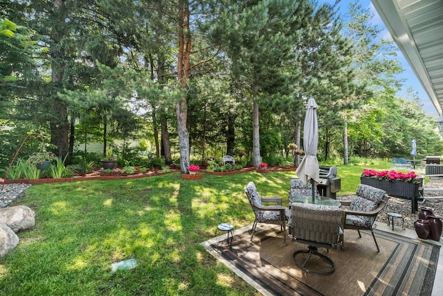 722 Hilltop Dr, Taylors Falls, MN 55084 - view of green lawn featuring outdoor dining area, a wooden deck, and view of scattered trees