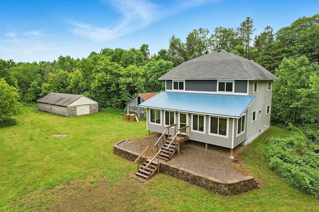 19316 Miller Rd, Dell Grove Twp, MN 55072 - rear view of property with a yard, a metal roof, a wooded view, and stairs