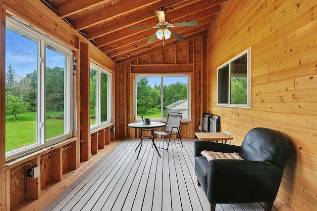 19316 Miller Rd, Dell Grove Twp, MN 55072 - sunroom with lofted ceiling, a ceiling fan, wood-type flooring, a wooden deck, and wood walls