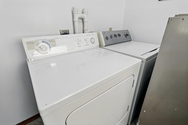 19316 Miller Rd, Dell Grove Twp, MN 55072 - laundry room featuring washing machine and clothes dryer