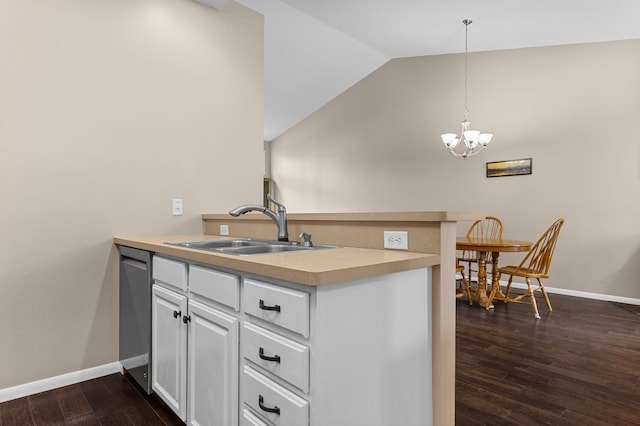 1437 131st Dr NE, Blaine, MN 55449 - kitchen with a peninsula, a chandelier, dark wood-type flooring, light countertops, and white cabinets