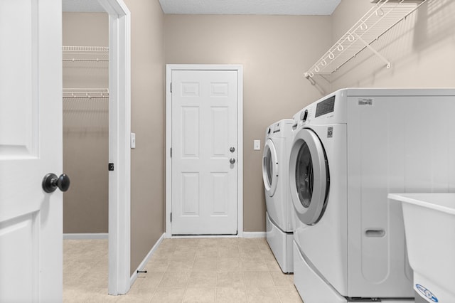 1437 131st Dr NE, Blaine, MN 55449 - washroom with separate washer and dryer and baseboards