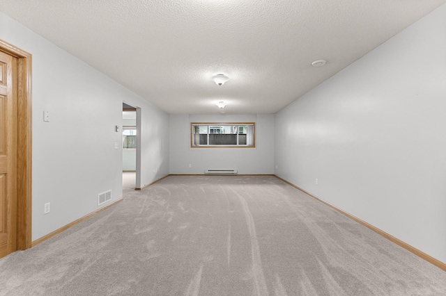 1437 131st Dr NE, Blaine, MN 55449 - unfurnished room with light carpet, a textured ceiling, and a baseboard radiator
