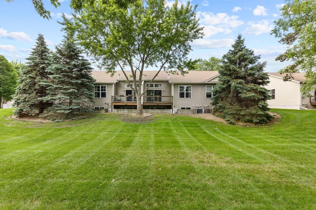 1437 131st Dr NE, Blaine, MN 55449 - back of property featuring a wooden deck and a lawn