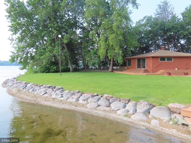 9429 Jeske Ave NW, Corinna Twp, MN 55302 - view of grassy yard featuring a water view