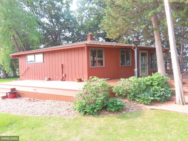 9429 Jeske Ave NW, Corinna Twp, MN 55302 - view of property exterior with a yard and a chimney