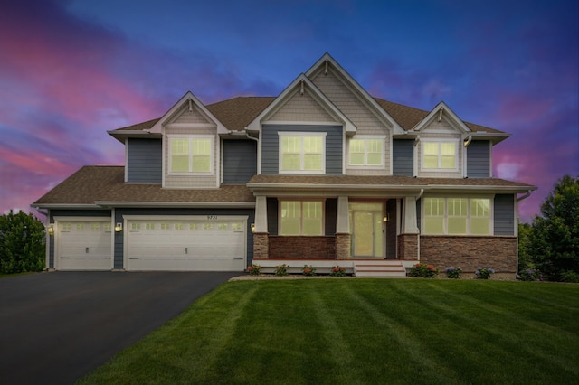 9721 Emerson Ct, Eden Prairie, MN 55347 - view of front facade featuring asphalt driveway, a porch, a lawn, and a shingled roof