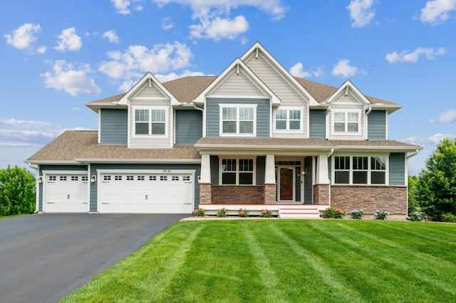 9721 Emerson Ct, Eden Prairie, MN 55347 - craftsman-style house with asphalt driveway, covered porch, a front lawn, stone siding, and roof with shingles