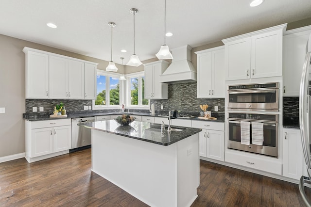 9721 Emerson Ct, Eden Prairie, MN 55347 - kitchen with stainless steel appliances, custom range hood, recessed lighting, decorative backsplash, and white cabinetry