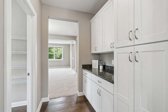 9721 Emerson Ct, Eden Prairie, MN 55347 - bar featuring baseboards and dark wood-type flooring