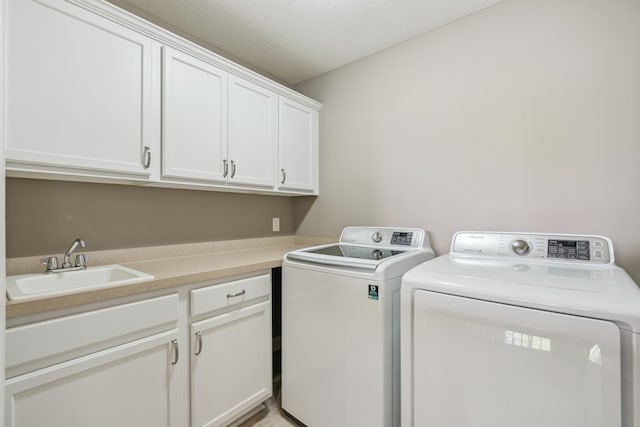 9721 Emerson Ct, Eden Prairie, MN 55347 - washroom featuring cabinet space, washer and clothes dryer, and a textured ceiling