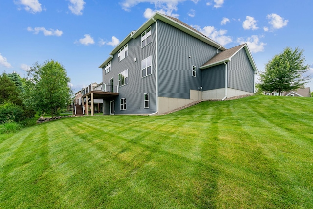 9721 Emerson Ct, Eden Prairie, MN 55347 - rear view of house featuring stairway, a wooden deck, and a lawn