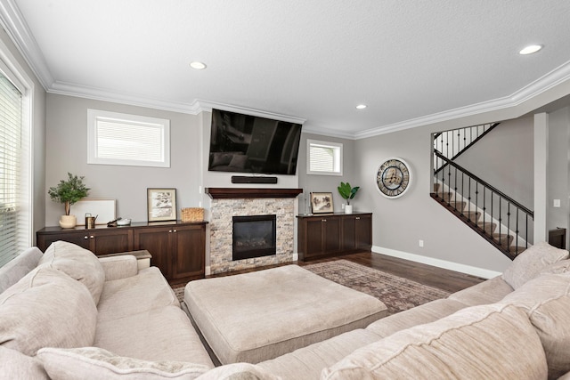 14675 77th St NE, Otsego, MN 55330 - living area with wood finished floors, ornamental molding, stairway, a stone fireplace, and recessed lighting