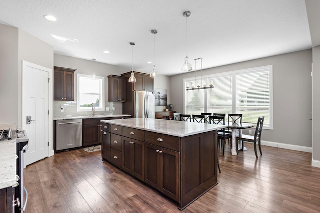 14675 77th St NE, Otsego, MN 55330 - kitchen with appliances with stainless steel finishes, dark brown cabinets, backsplash, dark wood-type flooring, and recessed lighting