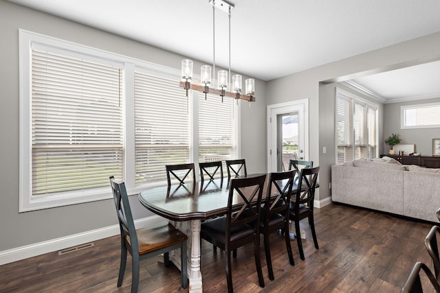 14675 77th St NE, Otsego, MN 55330 - dining room featuring dark wood-style floors and crown molding