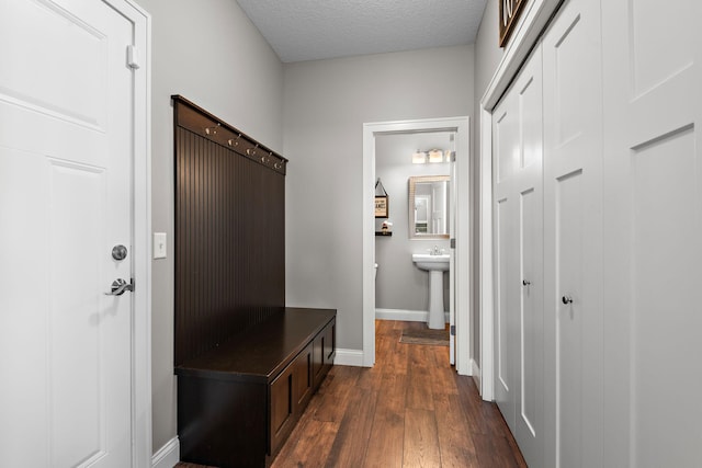 14675 77th St NE, Otsego, MN 55330 - mudroom featuring dark wood-style floors and a textured ceiling