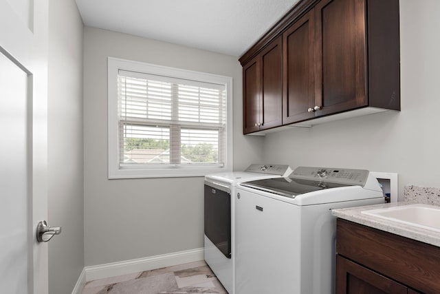 14675 77th St NE, Otsego, MN 55330 - washroom with separate washer and dryer, cabinet space, and light marble finish flooring