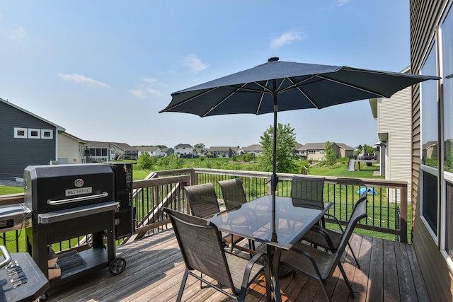 14675 77th St NE, Otsego, MN 55330 - wooden deck with outdoor dining space, a residential view, and a grill