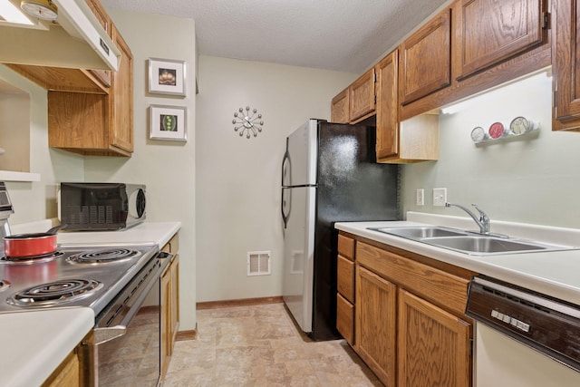 2254 Benson Ave Unit C, Saint Paul, MN 55116 - kitchen with white dishwasher, electric range oven, freestanding refrigerator, light countertops, and a textured ceiling
