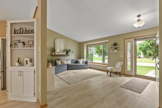 5278 River Wood Dr, Savage, MN 55378 - living area with light wood-type flooring and vaulted ceiling