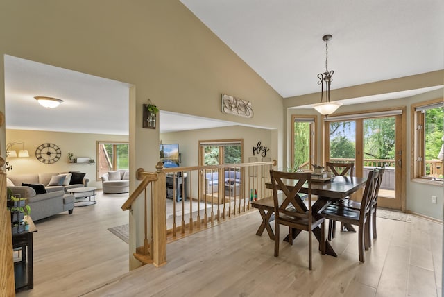 5278 River Wood Dr, Savage, MN 55378 - dining space with healthy amount of natural light, light wood-type flooring, and high vaulted ceiling