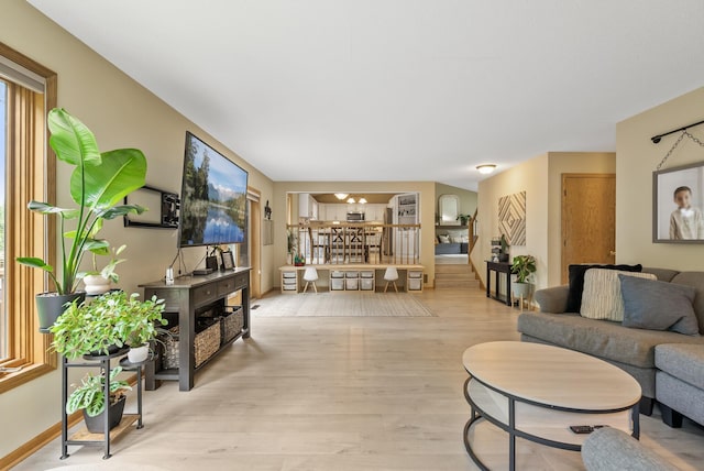 5278 River Wood Dr, Savage, MN 55378 - living area featuring light wood-style flooring and a chandelier