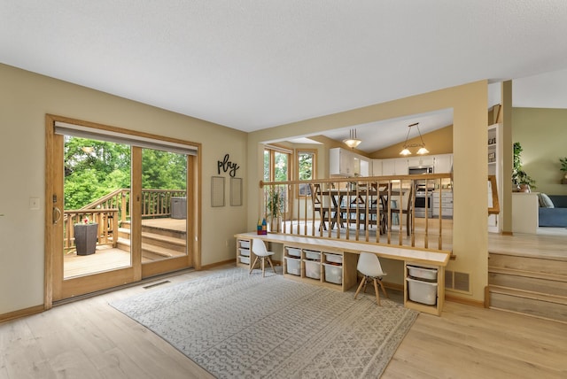5278 River Wood Dr, Savage, MN 55378 - dining room featuring plenty of natural light, light wood-type flooring, lofted ceiling, and a desk