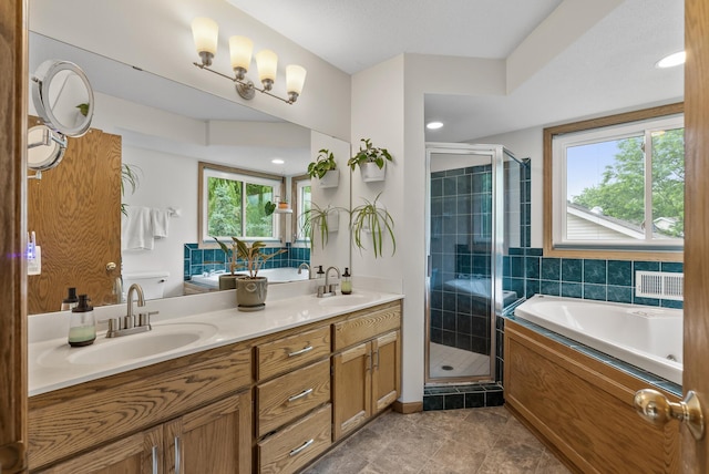 5278 River Wood Dr, Savage, MN 55378 - full bathroom with double vanity, a bath, a shower stall, and tile patterned flooring